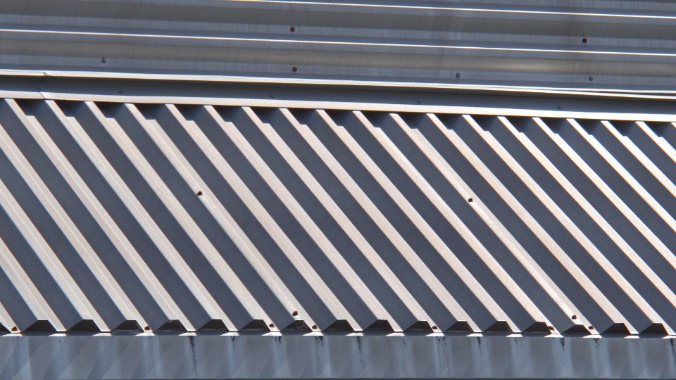 Ridged metal roofing panels